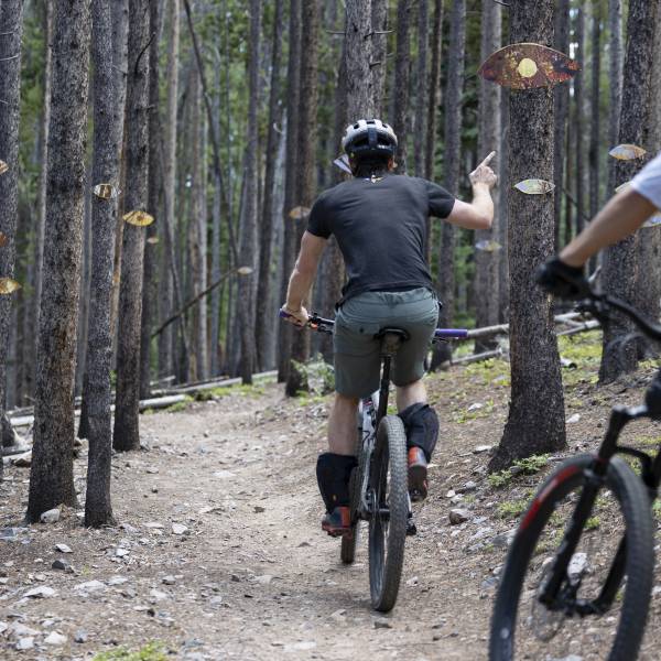 Mountain bikers on a Trail-Mix trail, which features an art installation, during Breckenridge International Festival of Arts