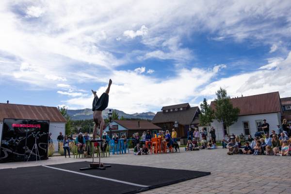 An acrobat with the Circa collective performs outdoors during the 2023 Breckenridge International Festival of Arts