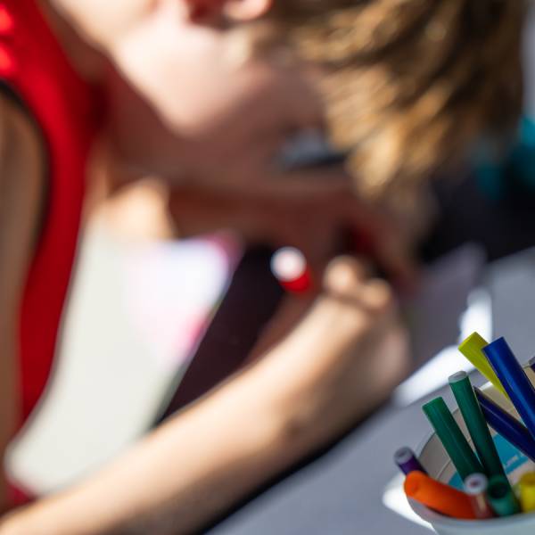 A child creates art during a Breck Create class