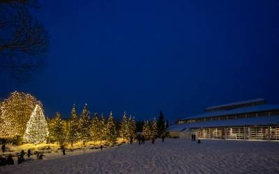 The exterior of the Riverwalk Center is shown on a winter evening in Breckenridge