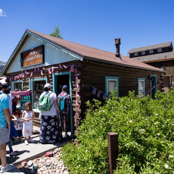 Visitors line up for a free art class outside of Quandary Antiques Cabin on the Breckenridge Arts District Campus