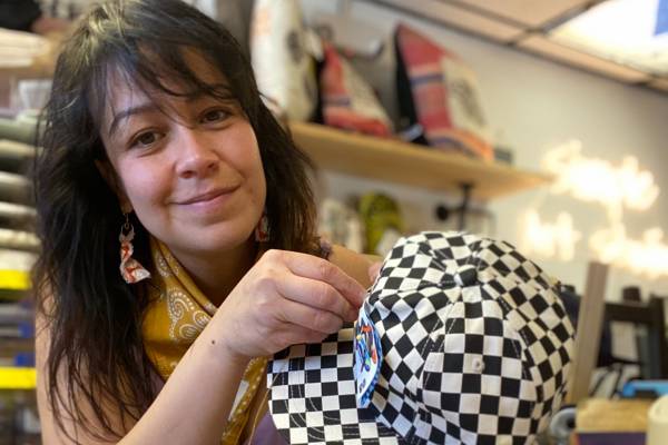 Local artist Kiki Díaz-Davis with one of her creations