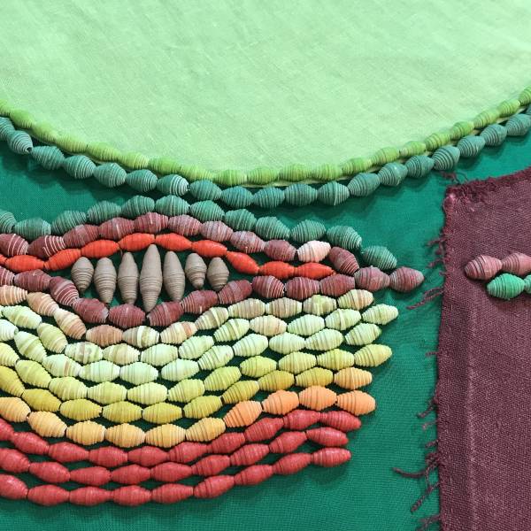 Mary Robinson paper beading project featuring cascading colors of green and red